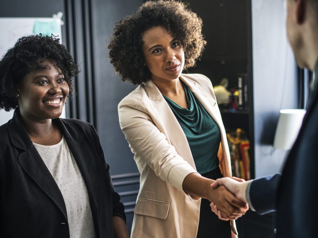 Business partners shaking hands in agreement